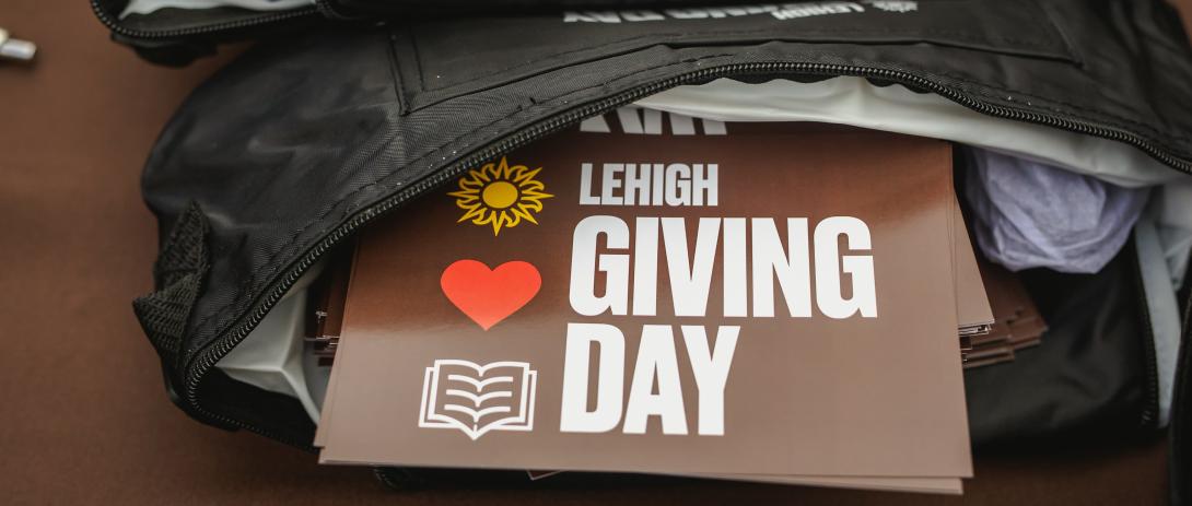 Lehigh Giving Day poster peaks out from a bag